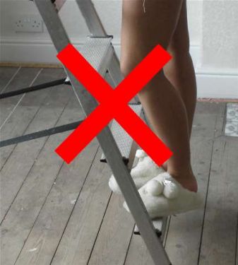 Step ladder wearing slippers- click to enlarge
