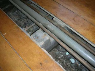 pipes under floor boards
