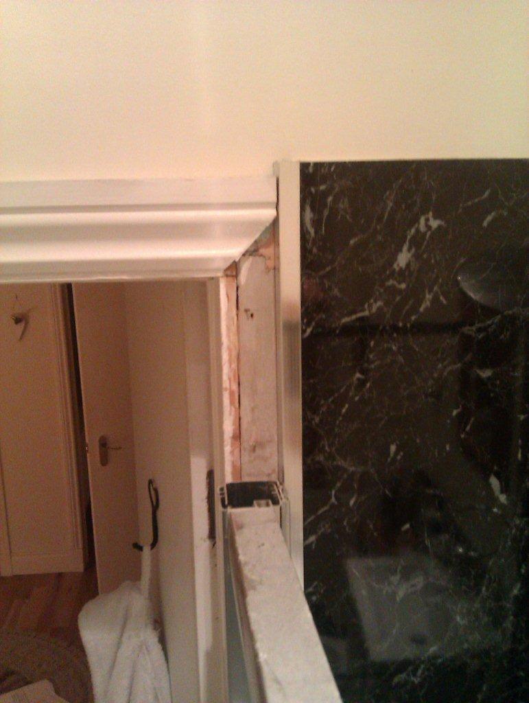 shower enclosure attached to door frame