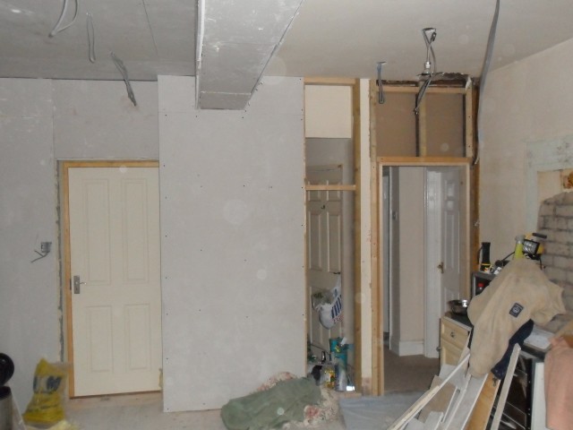 New kitchen door in place with casings on, to the left of that a little bit of plasterboarding to finish, behing there will be the downstairs W\C.