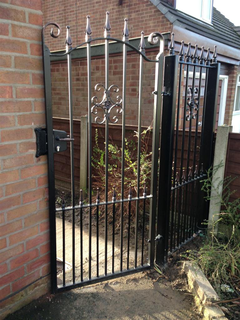 Wrought iron gate on Right of property plus side panel