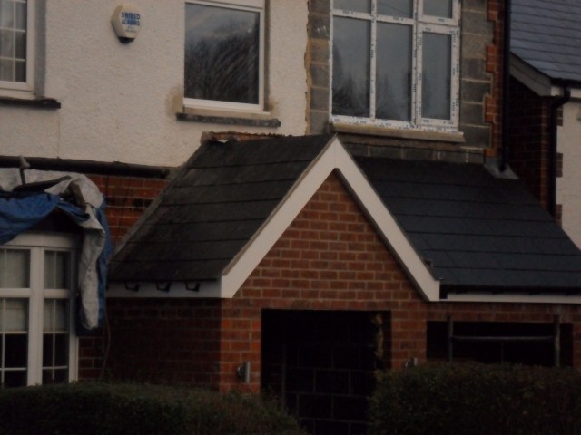 Porch and garage roof coming along