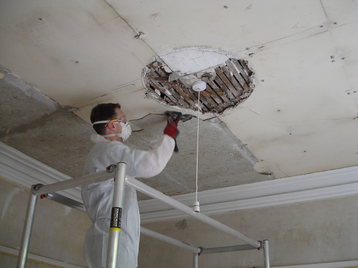 The previous owner butchered off an original Victorian ceiling rose in order to put the asbestos boards up!