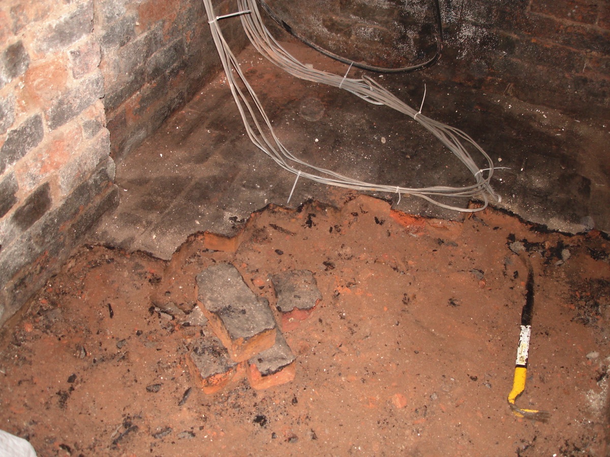 The coal cellar had an uneven brick floor so it had to come up and will be replaced with a slab