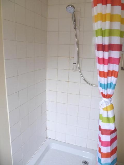 Shower room between kitchen and toilet