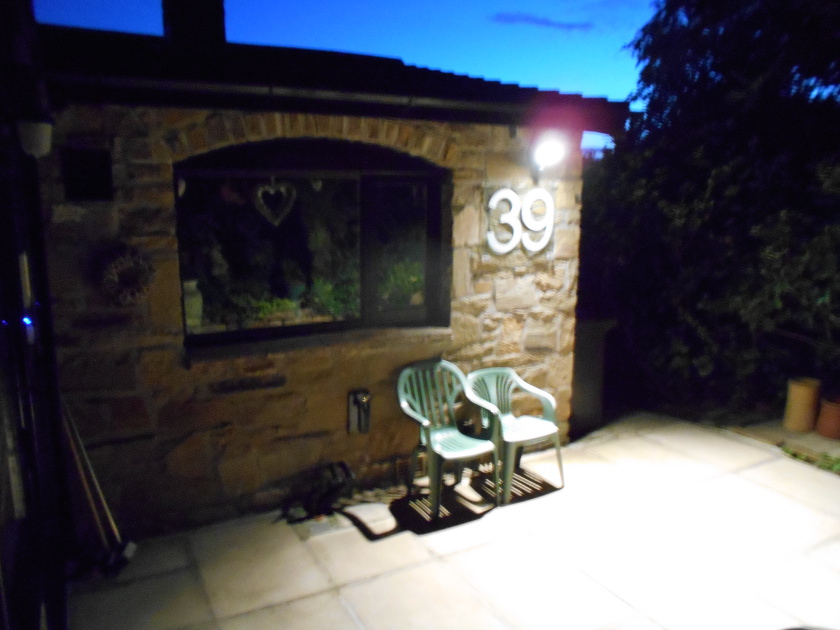 Numbers illuminated rear of bungalow..JPG