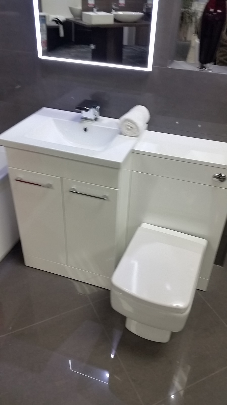 sink and toilet vanity as separated apart not joined together like in the pic this was just the show room one having it in a dark oak all round aswell and not the white like the bath