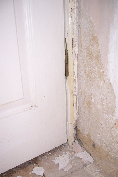 Bottom of door frame and wall