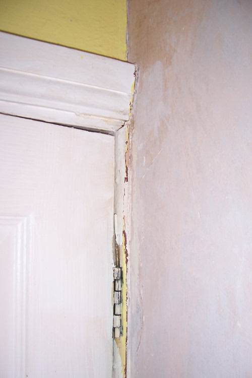 Top of door frame and wall