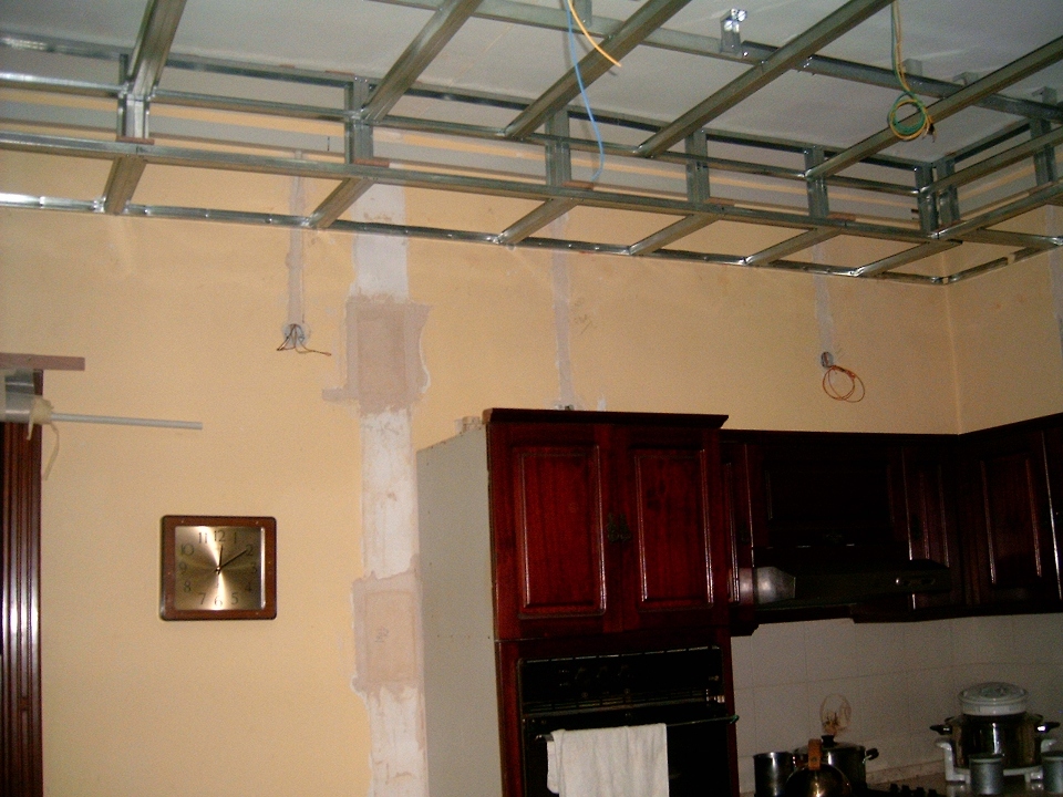 this shows a different angle of the ceiling supports and the old cupboard.