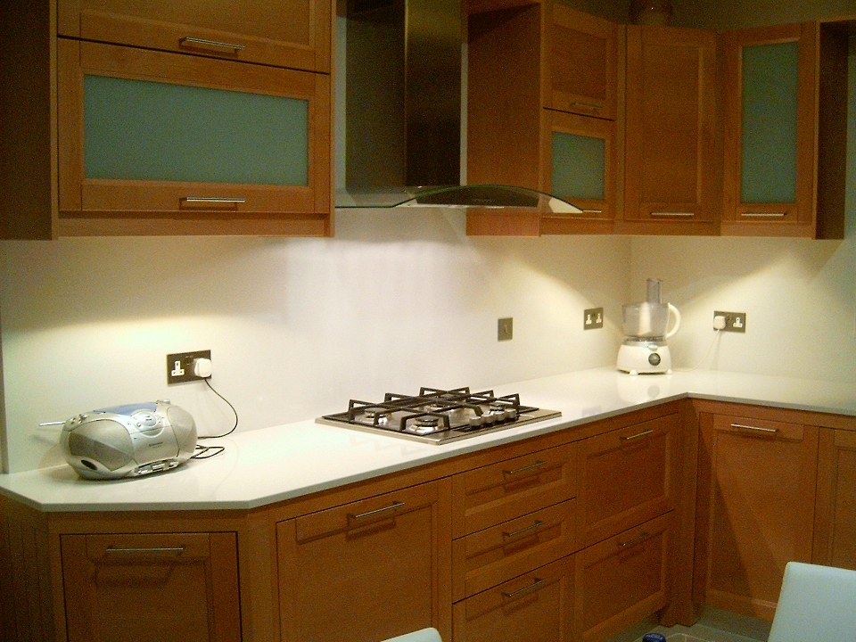 this shows the white quartz kitchen top and back which i myself manufactured and installed.