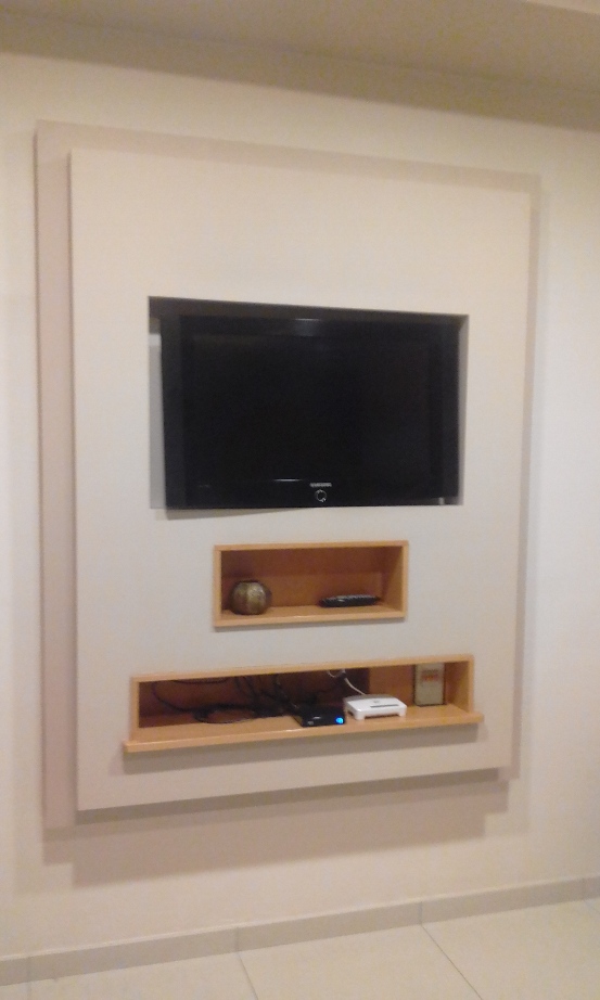 This is another wall of the kichen which i missed posting. The rectangular gypsum overhangs by about six inches from the wall so that it could house the tv and wall bracket, the wooden boxes are removable so that i can access the wall plugs, wiring etc,