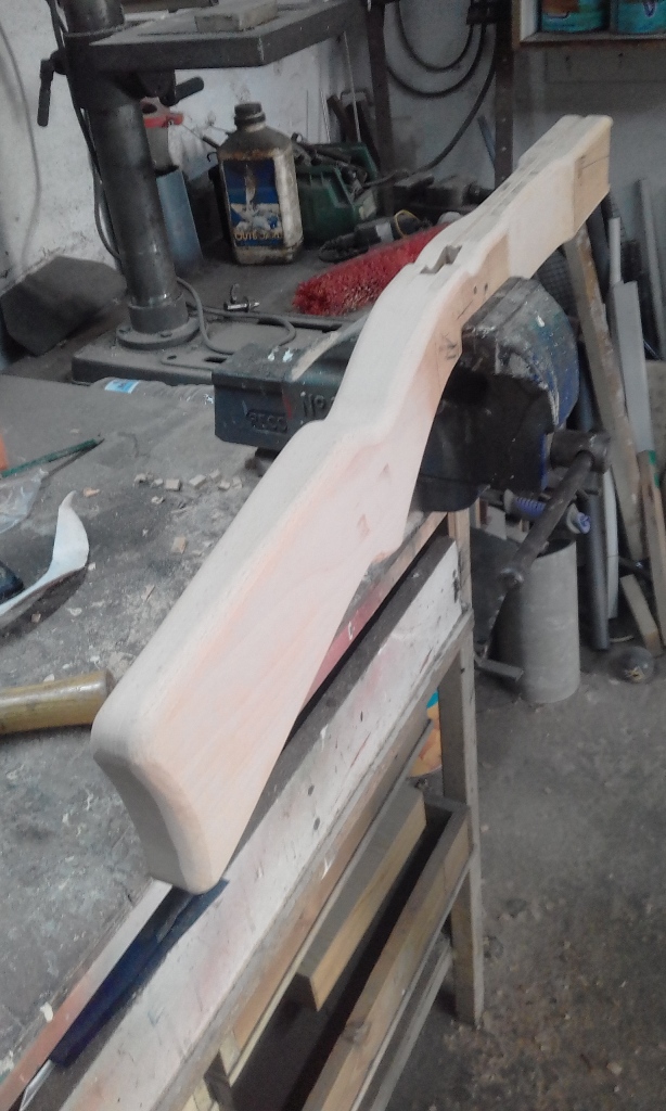 In this photo you can see the continued shaping of the wooden stock.