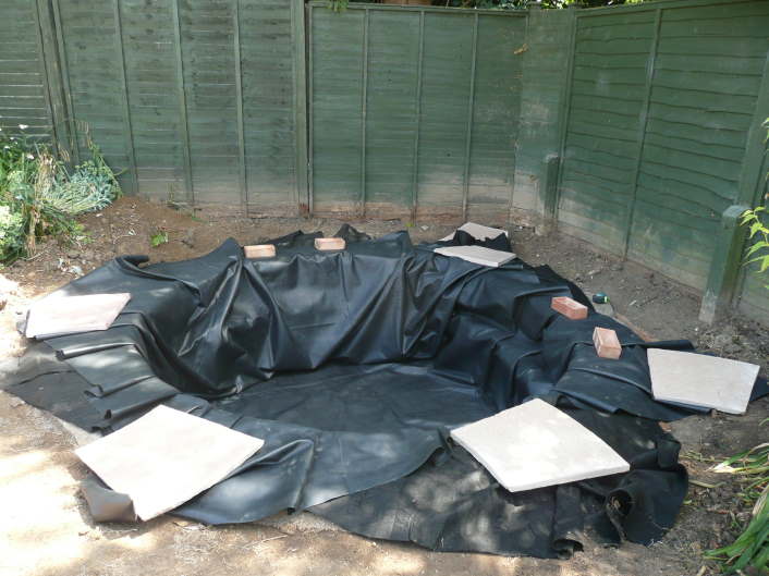 Step 5 - Lay the butyl liner and fold it carefully around the sides and the marginal planting shelves.